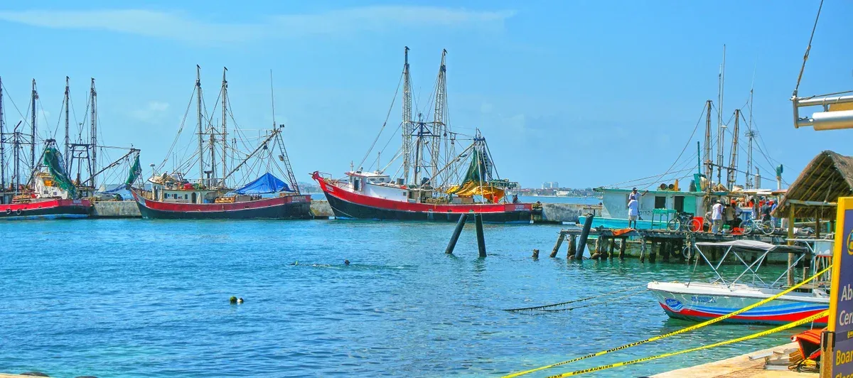 Shrimp boats and small launches moored at the Puerto Juarez waterfront north of Cancun, a departure point for Cancun yacht rentals
